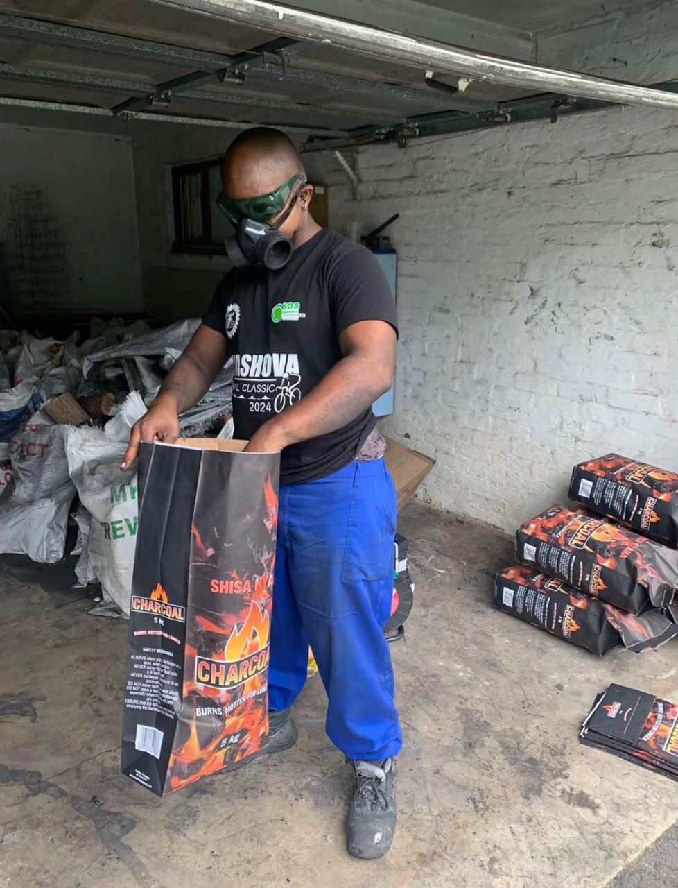 Worker loading branded bags in the warehouse