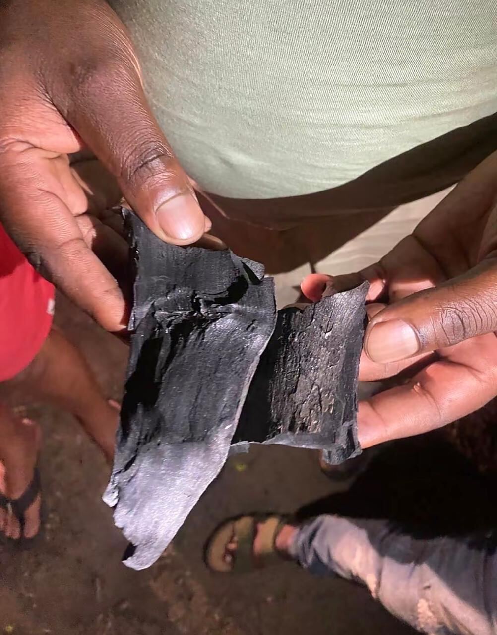 4 Brothers Coal team member preparing wood at the production kiln